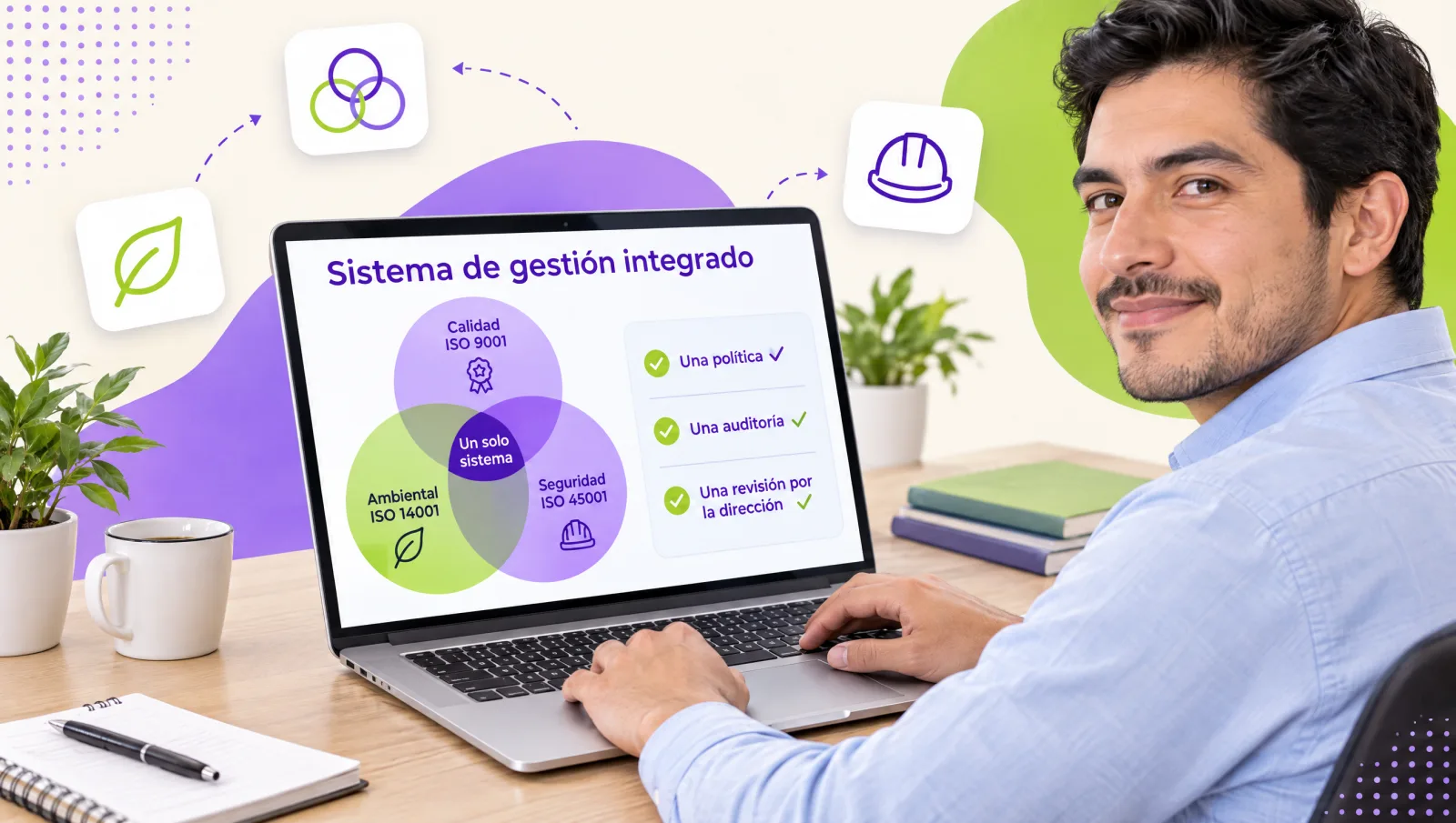 Management systems coordinator showing the diagram of an integrated ISO 9001, 14001 and 45001 system on a laptop
