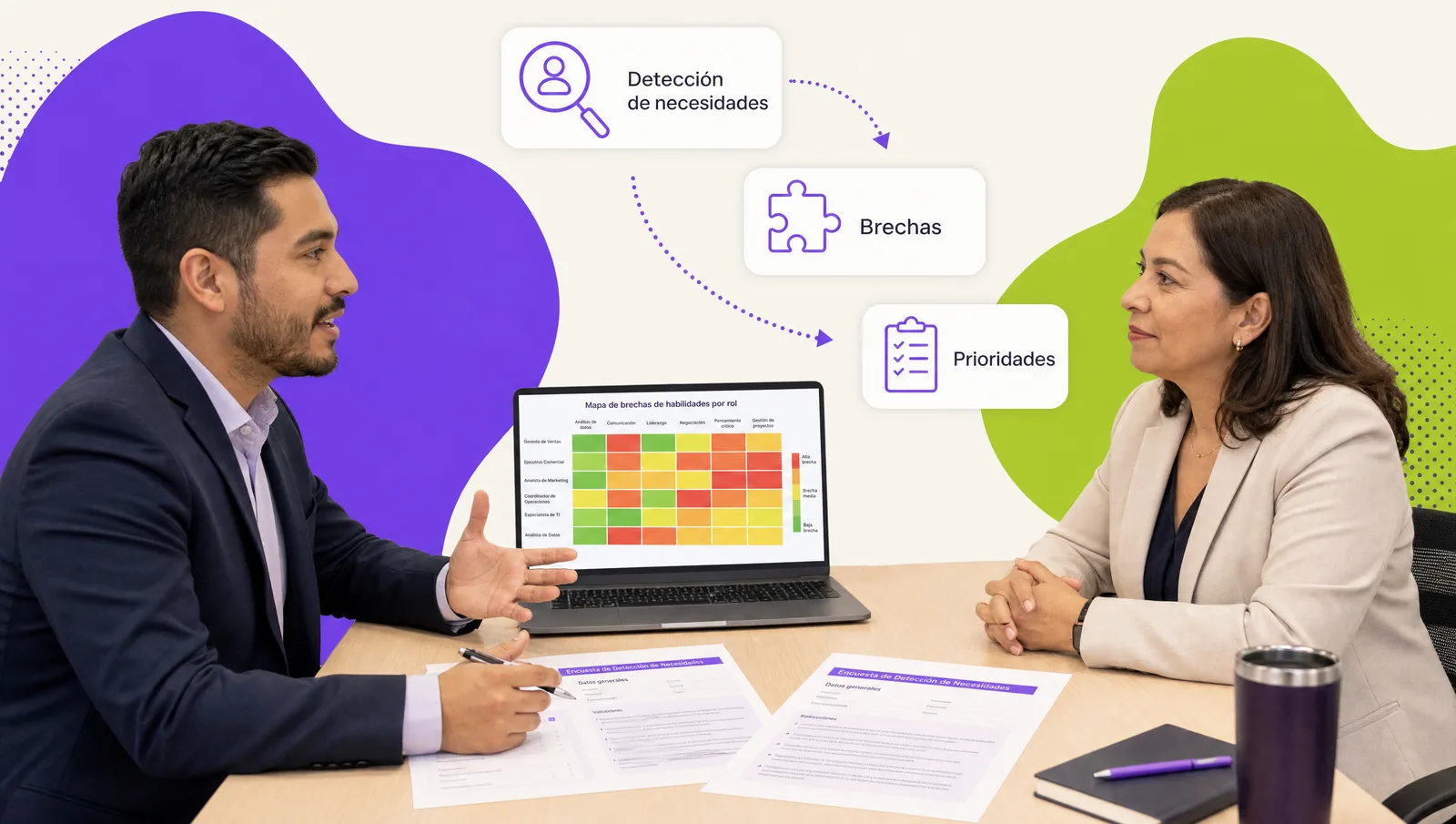 HR specialist reviewing a skills matrix by role on a screen with a department manager